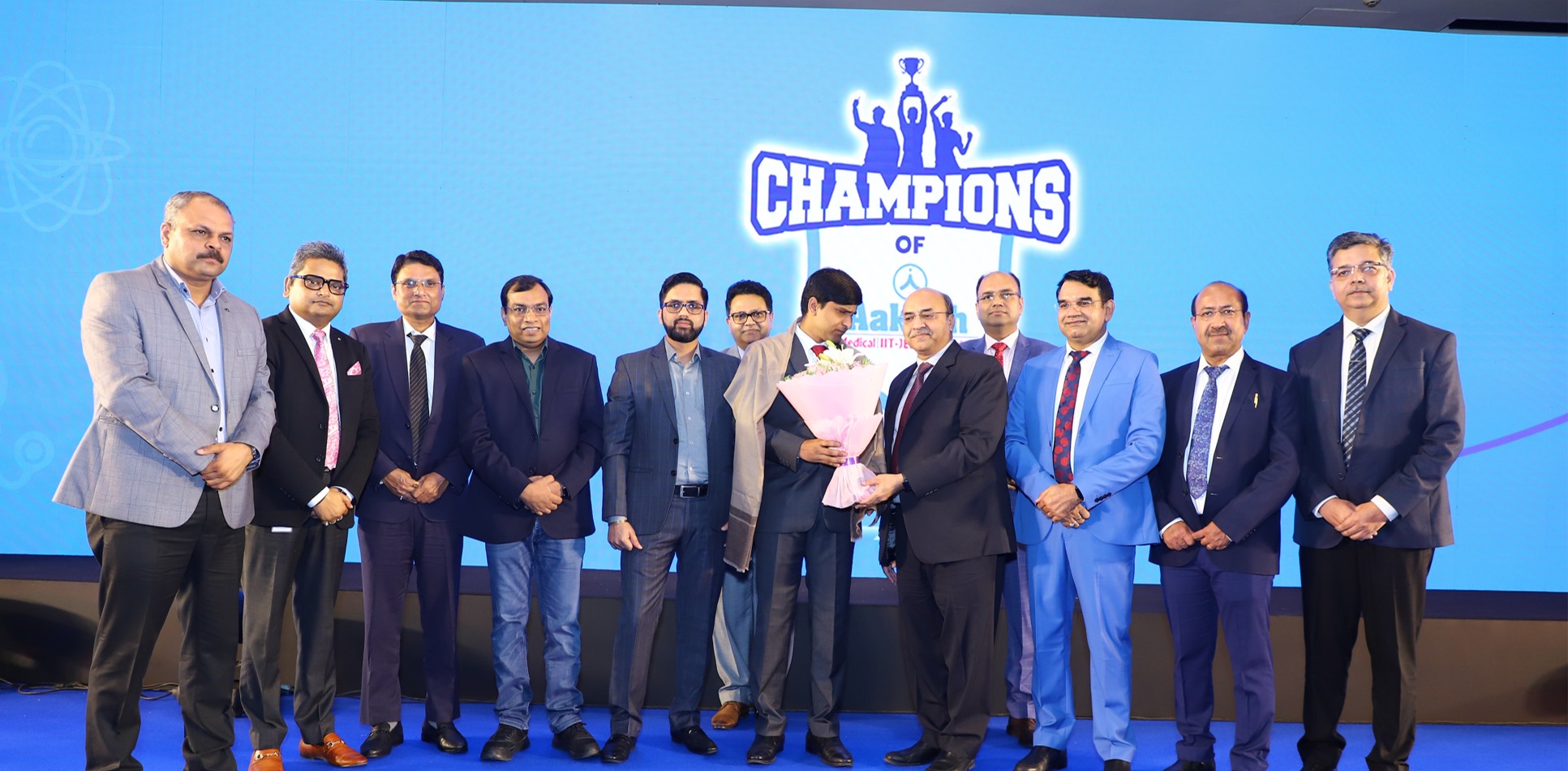Aakash faculty and felicitated toppers on stage at the Champions of Aakash ceremony