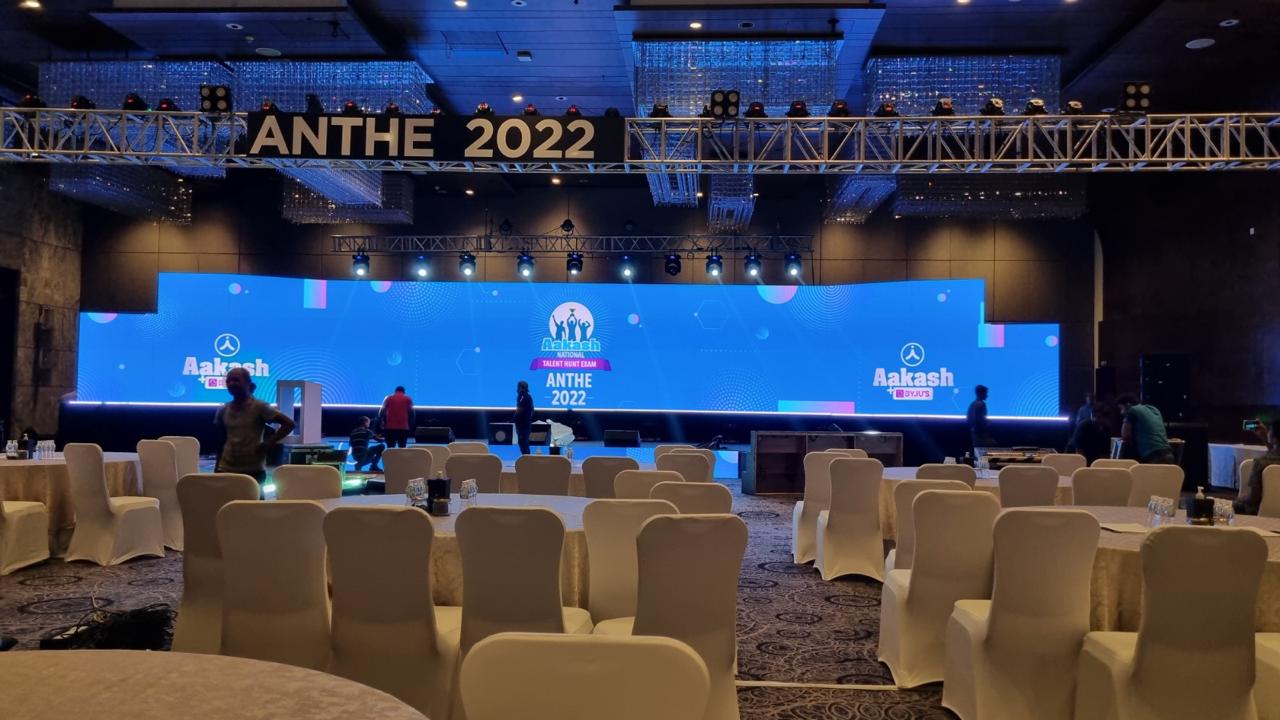 Aakash ANTHE 2022 Mega Launch stage with a full-width blue LED canvas and dimensional ANTHE lettering mounted on the overhead truss