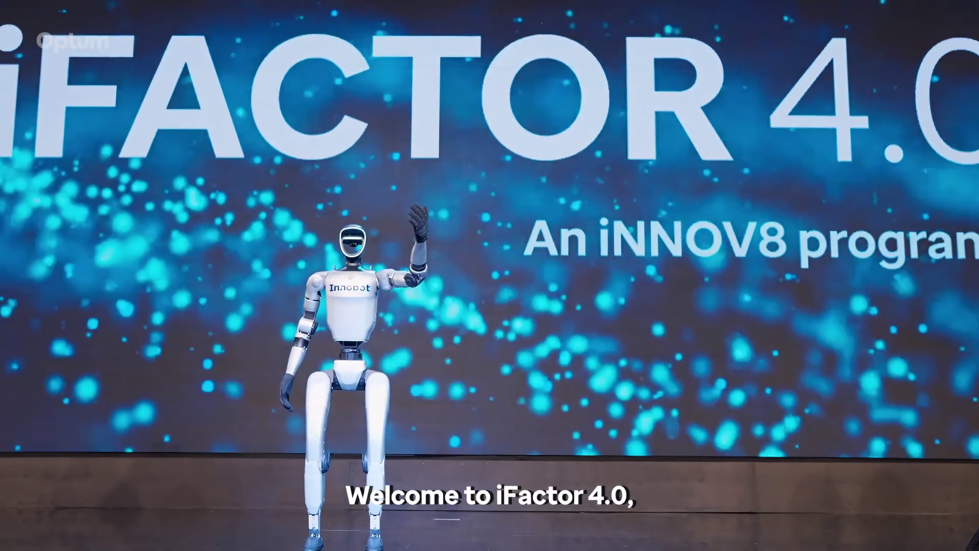 Humanoid robot on stage welcoming delegates to iFactor 4.0, an iNNOV8 program