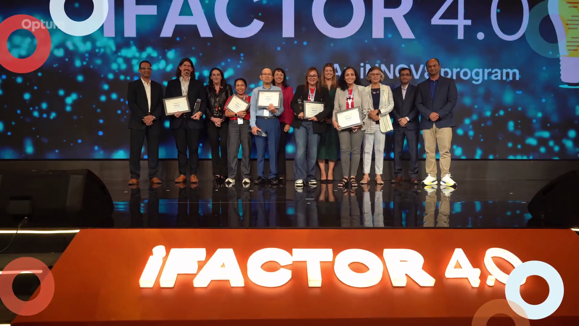 Winning teams on stage with their certificates at the iFactor 4.0 awards