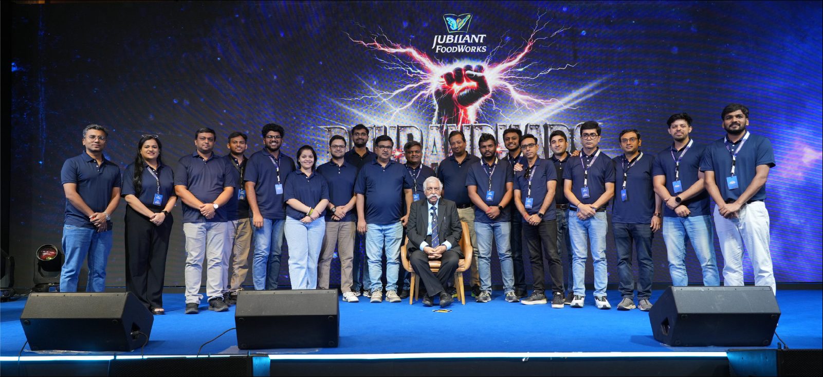 ISC leadership team on stage beneath the Dhurandhars – Hustle Se Haasil Tak LED backdrop at the Jubilant FoodWorks ISC Bootcamp 2026